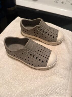 Gray Native shoes with White Toe Caps